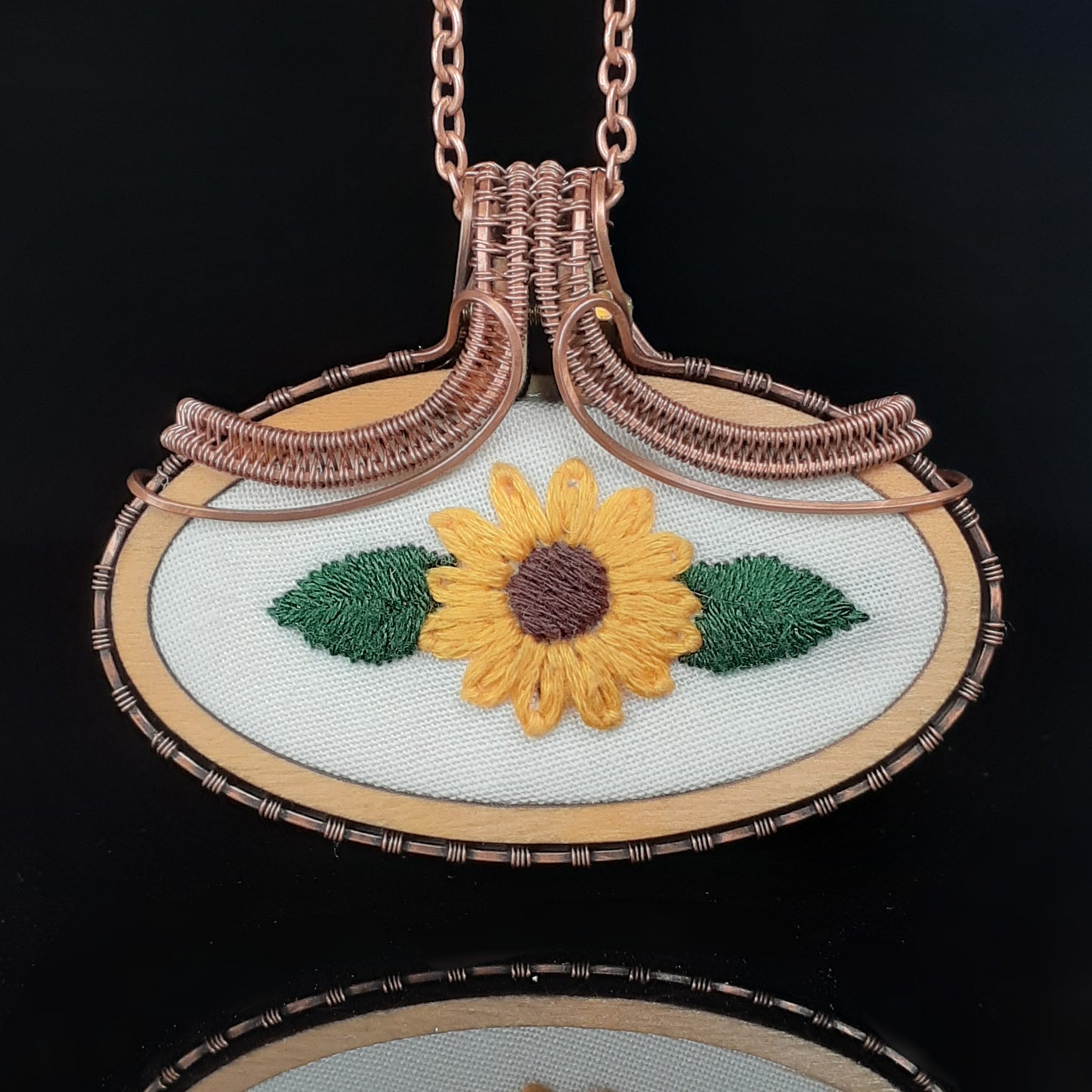 hand embroidered sunflower wrapped in copper wire. necklace pendant