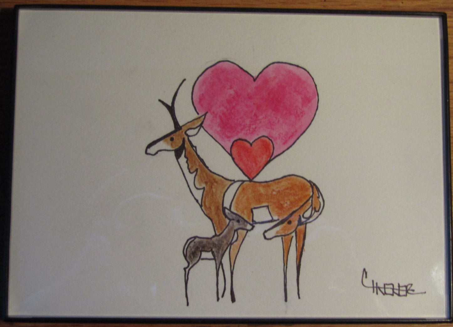 hand drawn pen and watercolor. antelope mom nuzzles her baby while dad looks on. 5" x 7" black plastic frame