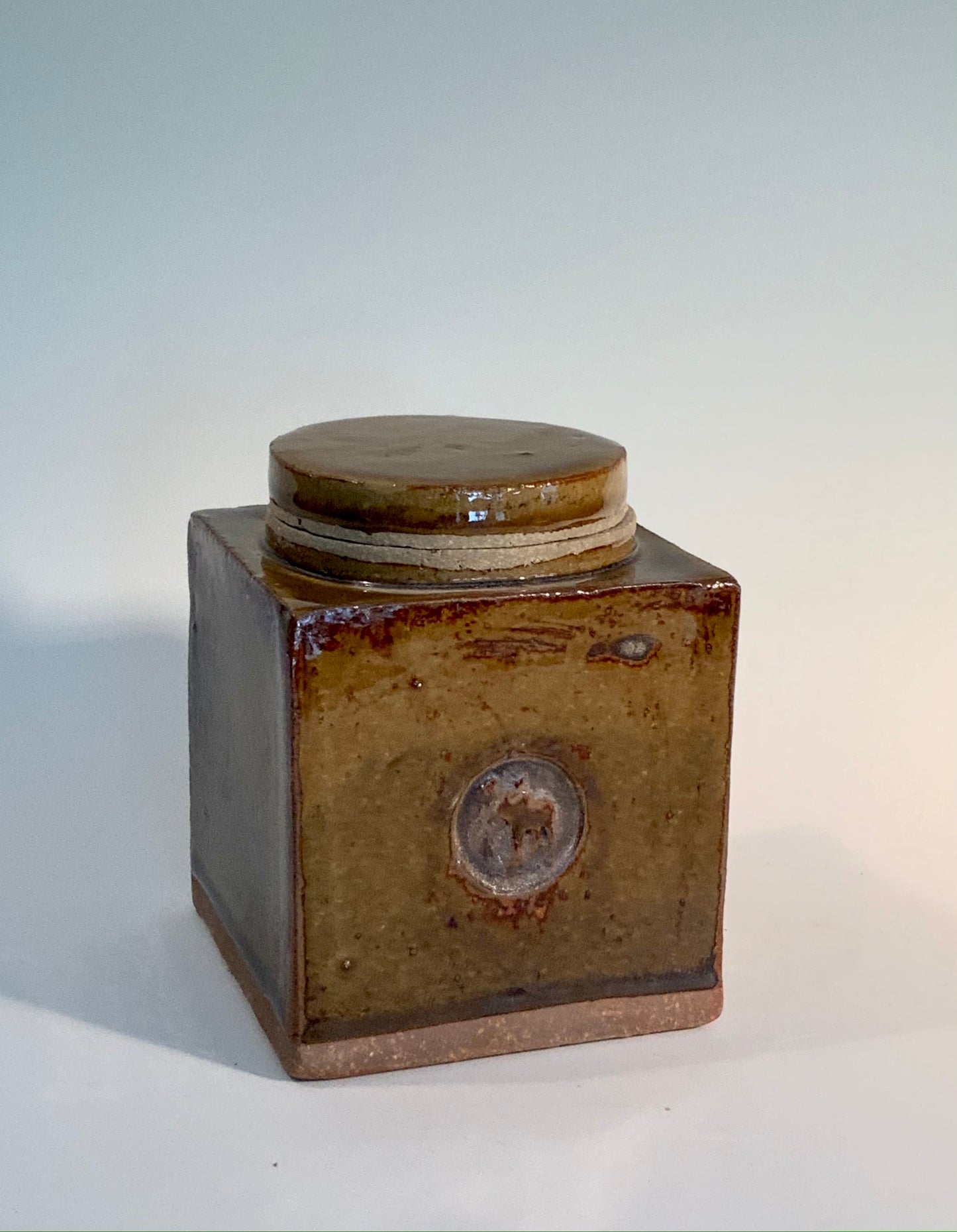 3.5" by 3.5" square jar with one moose stamp. round lid