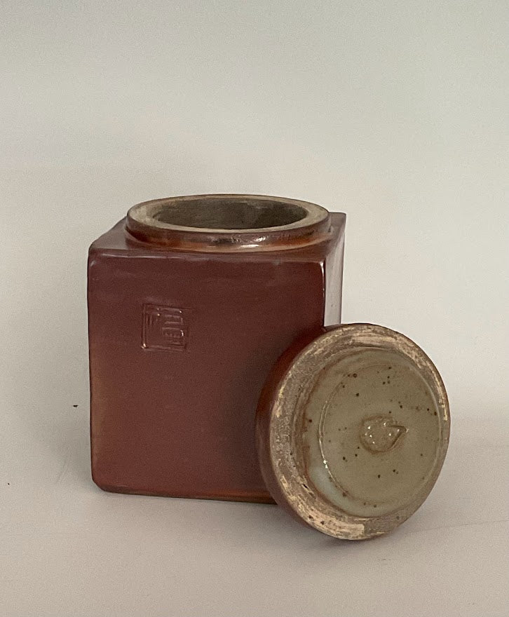Shino Glaze Lidded Jar With Stamp Muffy Moore: Ceramic Potter Hand thrown stoneware  Jar with lid  Shino glaze  Stamp on one side of the jar " Happiness "  Large opening with hedgehog stamp on underside of the lid  Dishwasher safe, oven and food safe  4" long x 4" wide x 4.5" tall