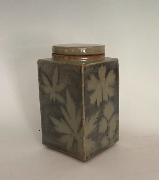 Wyoming Leaves Covered Stoneware Jar Muffy Moore: Ceramic Potter Hand thrown stoneware  Rectangle lidded slab jar  Leaves decorate all 4 sides of the jar  Chun blue glaze