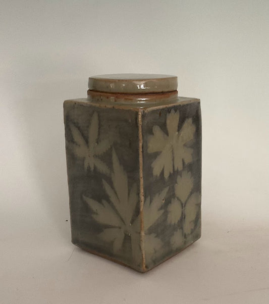 Wyoming Leaves Covered Stoneware Jar Muffy Moore: Ceramic Potter Hand thrown stoneware  Rectangle lidded slab jar  Leaves decorate all 4 sides of the jar  Chun blue glaze