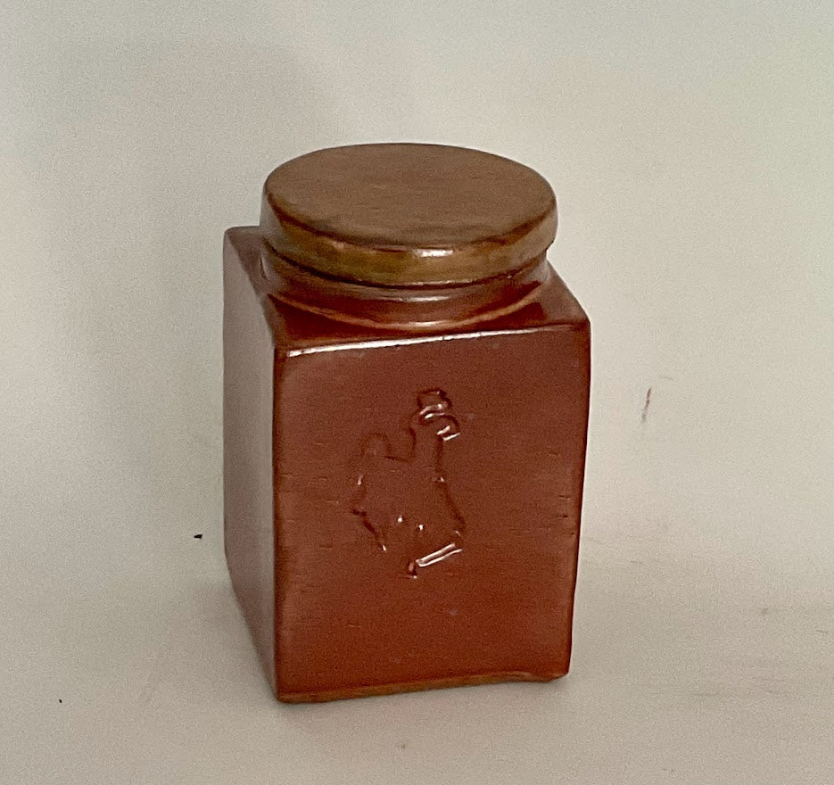 " Steamboat " Square Shino Square Vase With Lid Muffy Moore: Ceramic Potter Hand thrown stoneware vase  Stamped with " Steamboat " the logo for the University of Wyoming  Copper looking shino glaze  Square vase with lid