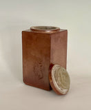 Shino Glaze " Steamboat " Lidded Jar Muffy Moore: Ceramic Potter Hand thrown stoneware  Square jar with lid  Shino colored glaze  " Steamboat " stamp on one side  Dishwasher safe, oven and food safe  3" long x 3" wide x 6" tall  Nice storage container for any Wyoming fan
