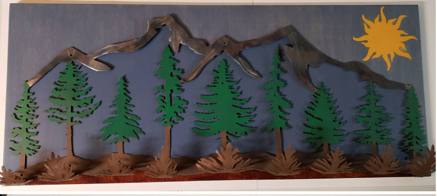 metal and wood coat hanger. mountains, pine trees and the sun