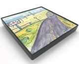 Framed with a small, affordable frame for wall or table top display  4" long x " high x 1/4" wide   Old highway road with an old fashioned "GAS" sign  In the background are power lines and a windmill