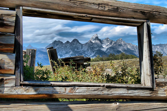 The image is one of the Tetons in Grand Teton National Park through an old cabin window along the Gros Ventre Road. 5 x 7 card is blank inside and comes with the envelope.