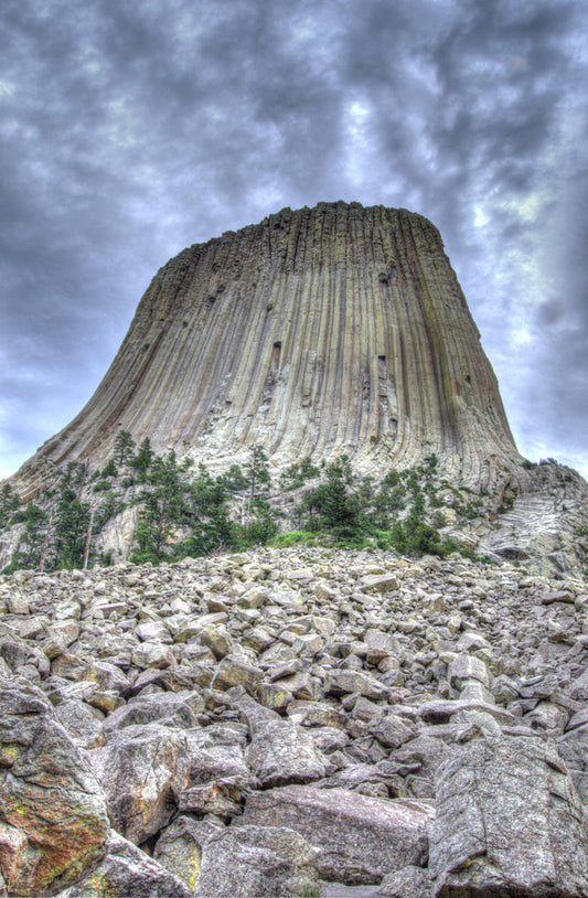 The card measures 5x7 and is standard card stock folded with full photo border.  The inside is blank which makes it suitable for any occasion.  Blank envelope is included. The image is one of Devil's Tower, Devil's Tower National Monument, Wyoming and looks up the monument from the boulder field that frames its base.