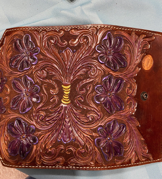 hand tooled flowers dyed purple. Ladies clutch purse with coin pocket. snap closure