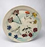 hand painted Wyoming wild flower motif on a blue wash porcelain decorative platter.  Wire Hanger on the back