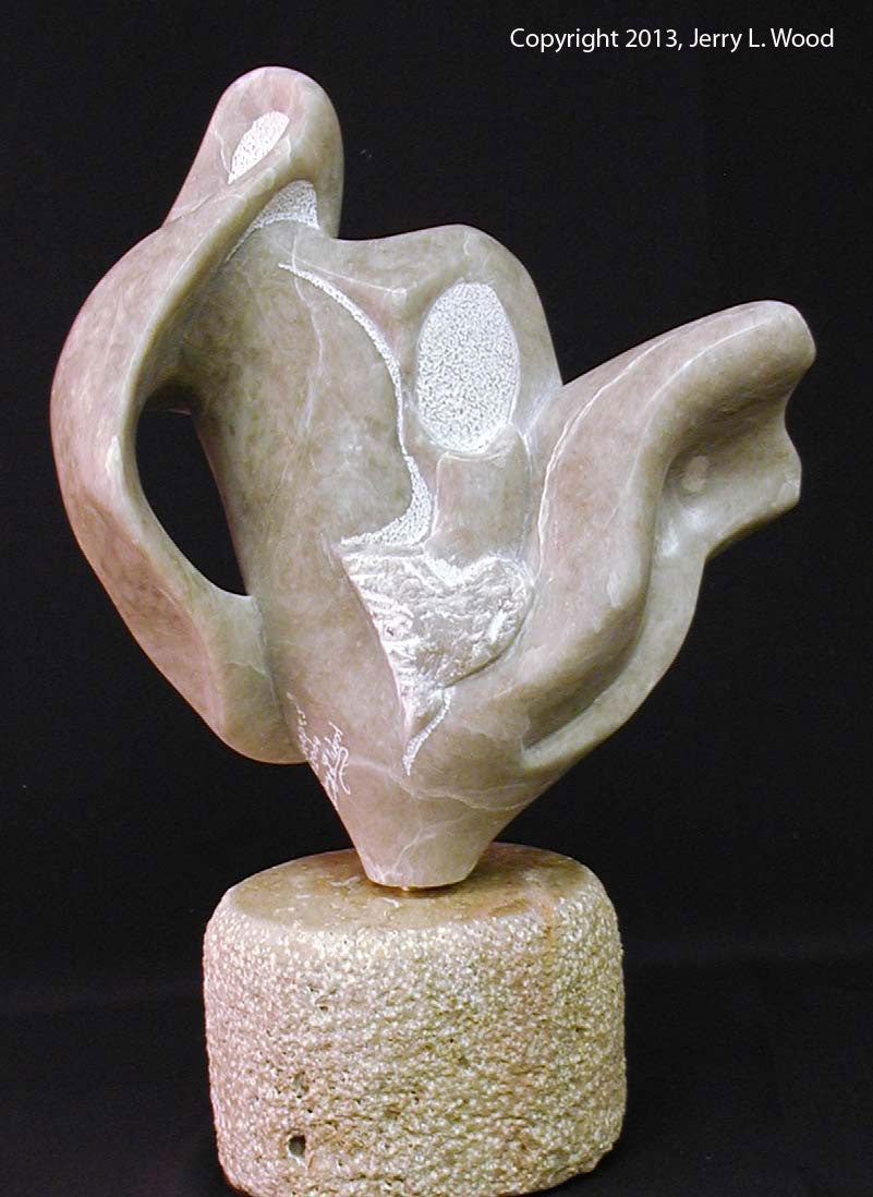 " Shapes " Alabaster Sculpture Sculpture Artist: Jerry Wood  Carved from Colorado Alabaster   Shapes and textures from the Colorado Alabaster   11" long x 7" wide x 16" high   Comes with a base for display  Sculpture is removable from base  Attaches to base with metal peg  Will turn on the base for maximum viewing  Title, date and artist signature carved into lower edge of the piece  This very unique and one of a kind piece will be the center of attention in any collection