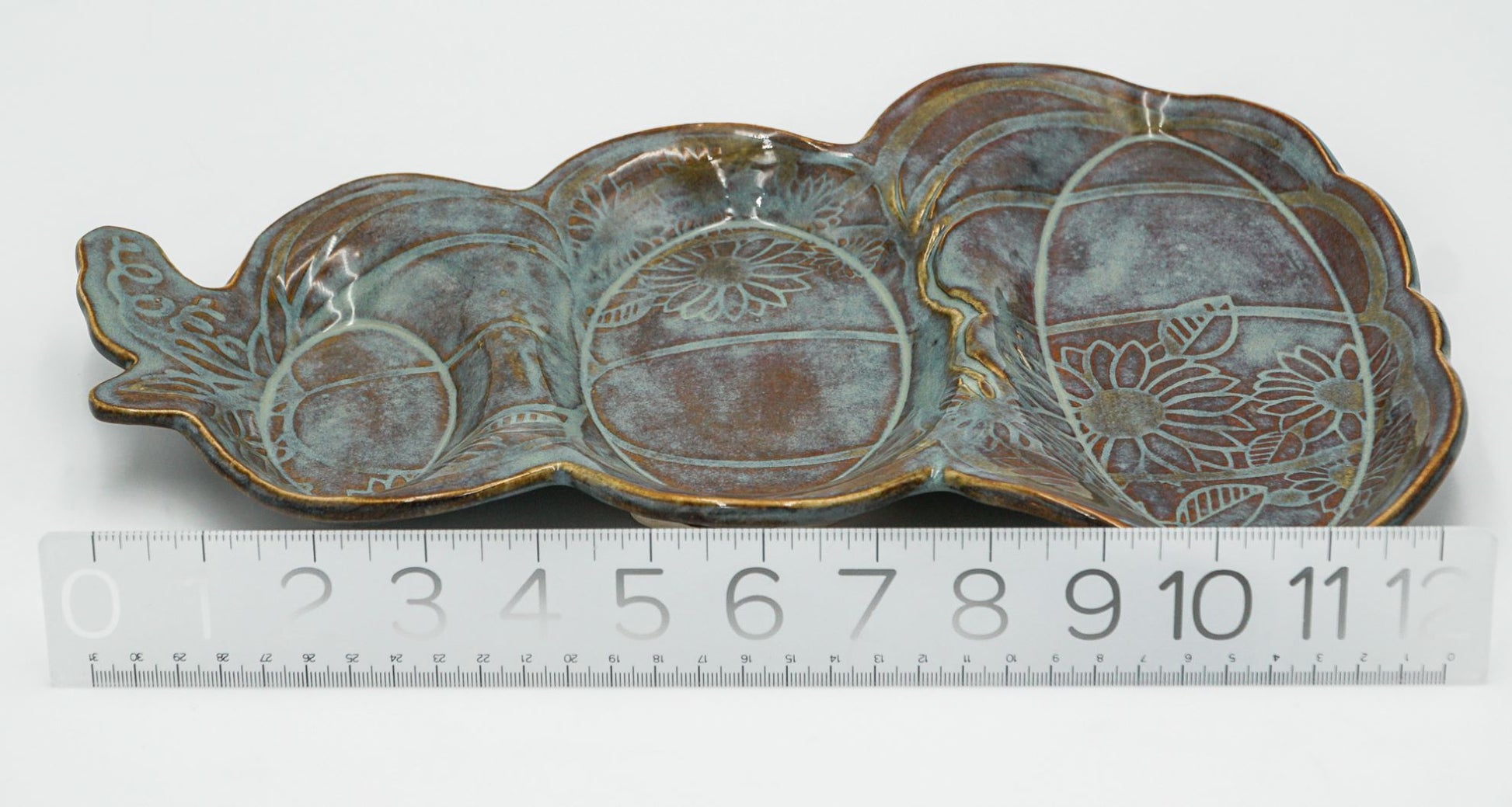 Sectional Pumpkin Ceramic Platter 3-part sectional pumpkin and sunflower serving platter.  Longest length dimension: 13.5 inches