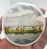 " Wild Ponies " Sticker Artist: Nancy Marlatt  Circular Vinyl Sticker  3" across  Horses standing in the wild open country  Print from an original work by the artist  Great to use on a water bottle, laptop, or anywhere for decoration  Made from Nancy Marlatt's original artwork  Sticker is a high quality custom vinyl sticker that has UV laminate on top  Which means they are outdoor friendly and protected for wind, rain and sunlight  They are even dishwasher safe  Matt Finish