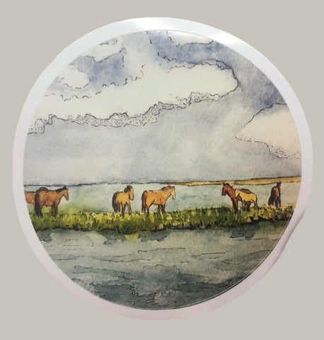" Wild Ponies " Sticker Artist: Nancy Marlatt  Circular Vinyl Sticker  3" across  Horses standing in the wild open country  Print from an original work by the artist  Great to use on a water bottle, laptop, or anywhere for decoration  Made from Nancy Marlatt's original artwork  Sticker is a high quality custom vinyl sticker that has UV laminate on top  Which means they are outdoor friendly and protected for wind, rain and sunlight  They are even dishwasher safe  Matt Finish