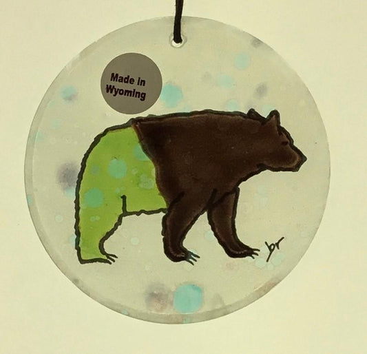 Bear Moon Ornaments Artist: Elizabeth Rulli  Glass round moon ornaments   Hanging ties that can hang the ornament that are hand paint with bear on each glass ornament  Great for that western look on a tree or just hanging in the window as a sun catcher   2.5" diameter   Please note, each piece is custom designed by the Artist , with a slight variation between each piece