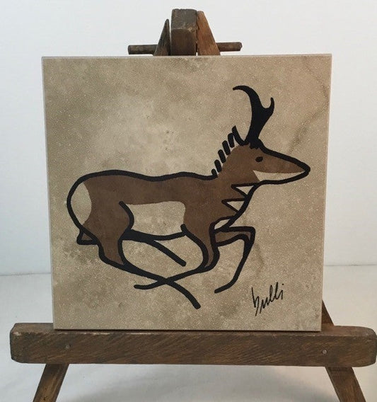 Pronghorn Trivet Artist: Elizabeth Rulli A recycled trivet from Habitat for Humanity  Restore with a Indian Paintbrush hand paint on trivet  Wood bottom with felt pads on bottom coroners  Hand painted and fired to 1375 degrees and will clean with scouring power if a pan leaves a mark  A Pronghorn is painted on each trivet