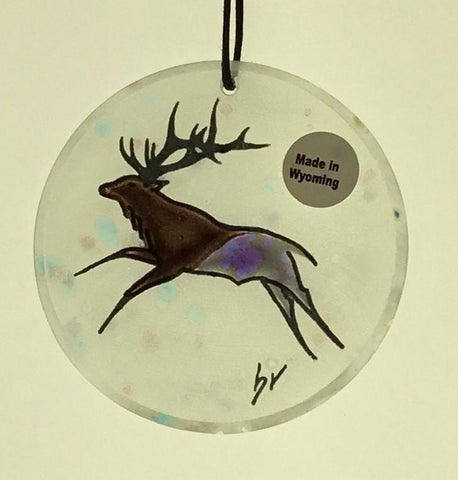 Elk Moon Ornaments Artist: Elizabeth Rulli  Glass round moon ornaments   Hanging ties that can hang the ornament that are hand paint with elk on each glass ornament  Great for that western look on a tree or just hanging in the window as a sun catcher   2.5" diameter   Please note, each piece is custom designed by the Artist , with a slight variation between each piece