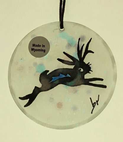 Jackalope Moon Ornaments Artist: Elizabeth Rulli  Glass round moon ornaments   Hanging ties that can hang the ornament   Hand painted   Jackalope hand painted on each glass ornament  Great for that western look on a tree or just hanging in the window as a sun catcher   2.5" diameter   Please note, each piece is custom designed by the Artist , with a slight variation between each piece