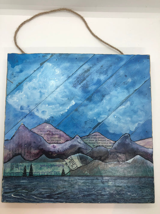 "Be Other Than" Square Wood Plaque Painting Artist: Nancy Marlatt Water color, gouache, acrylic, ink on vintange and plank boards.  Landscape of mountains, clouds and lake  Wire hanger and jute hanger option  10" Wide x 10" Long x 1" Deep  Please note, each art piece is hand created by the Artist , with a slight variation between each piece