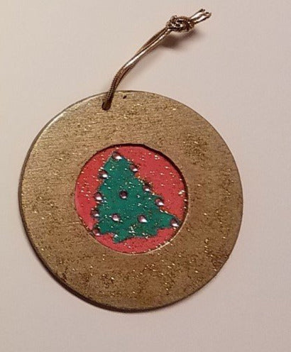round wooden ornament with fabric tree inlay
