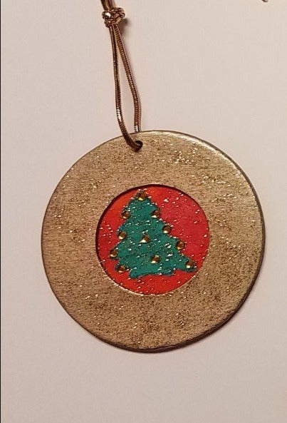 round wooden ornament with hand embellished fabric tree inlay