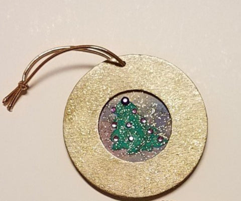 wooden ornament with hand embellished tree inlayed inside