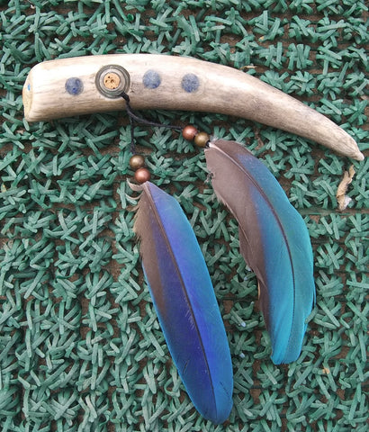 Antler with Lapis and bead inlays  Small " wishing bottle " inserted into the antler  Metal beads with two feathers attached to the bottle  6" long x 1" wide x 1" high