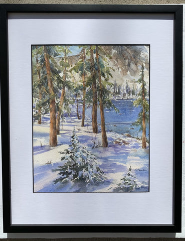 Original watercolor painting  View through the pine trees toward Lake Marie in the Snowy Range Mountains on a snowy winter day  11 3/4" long x 14 3/4" high x 3/4" wide as framed  Matted in a white mat  Framed in a sleek black frame with glass cover  Sawtooth on the back of the frame for hanging