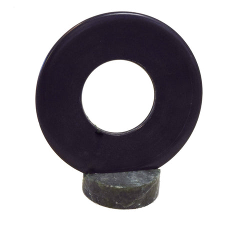 Black Serpentine Jade " Bi Stone "  Base is made from Wyoming Jade  Jade goes into Serpentine in about 1/2 million years  3 3/4" across Bi Stone  1 1/4" across base   A unique piece of art that will be the center of conversation