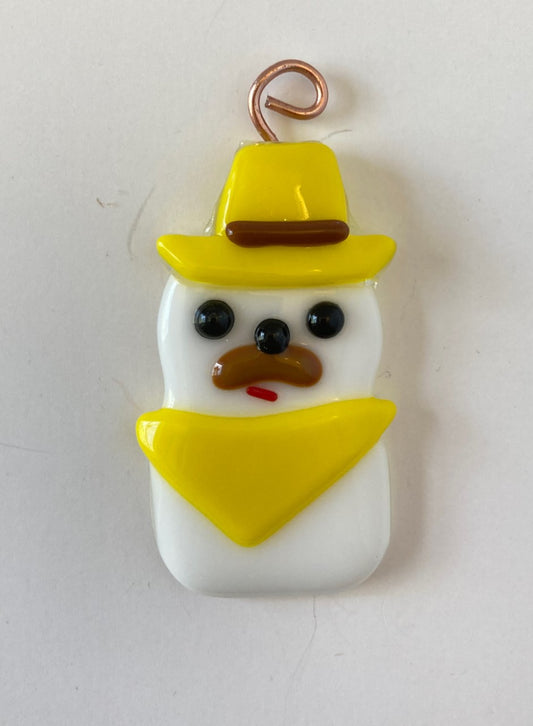 fused glass cowboy snowman. wearing yellow hat and bandana. Ornament