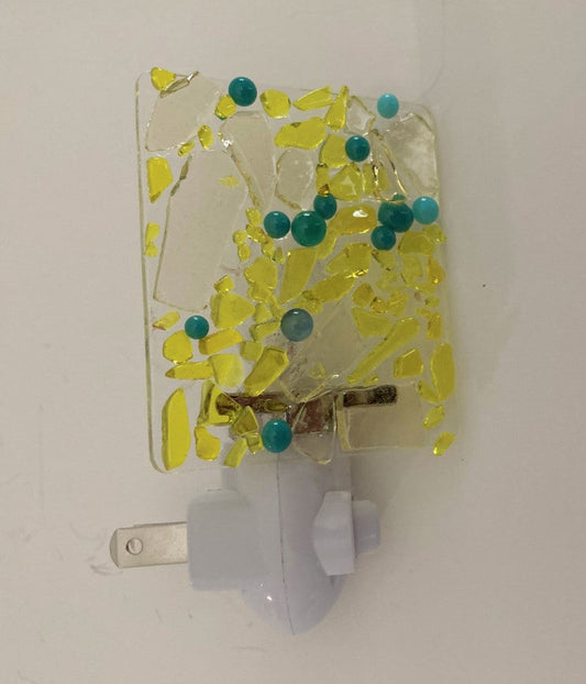 Fused Glass Nightlight  Yellow fractured glass with turquoise dots  2 1/2" long x 3" high x 1/4" wide fused glass  Total height of glass and nightlight is 4"  2 prong plug 